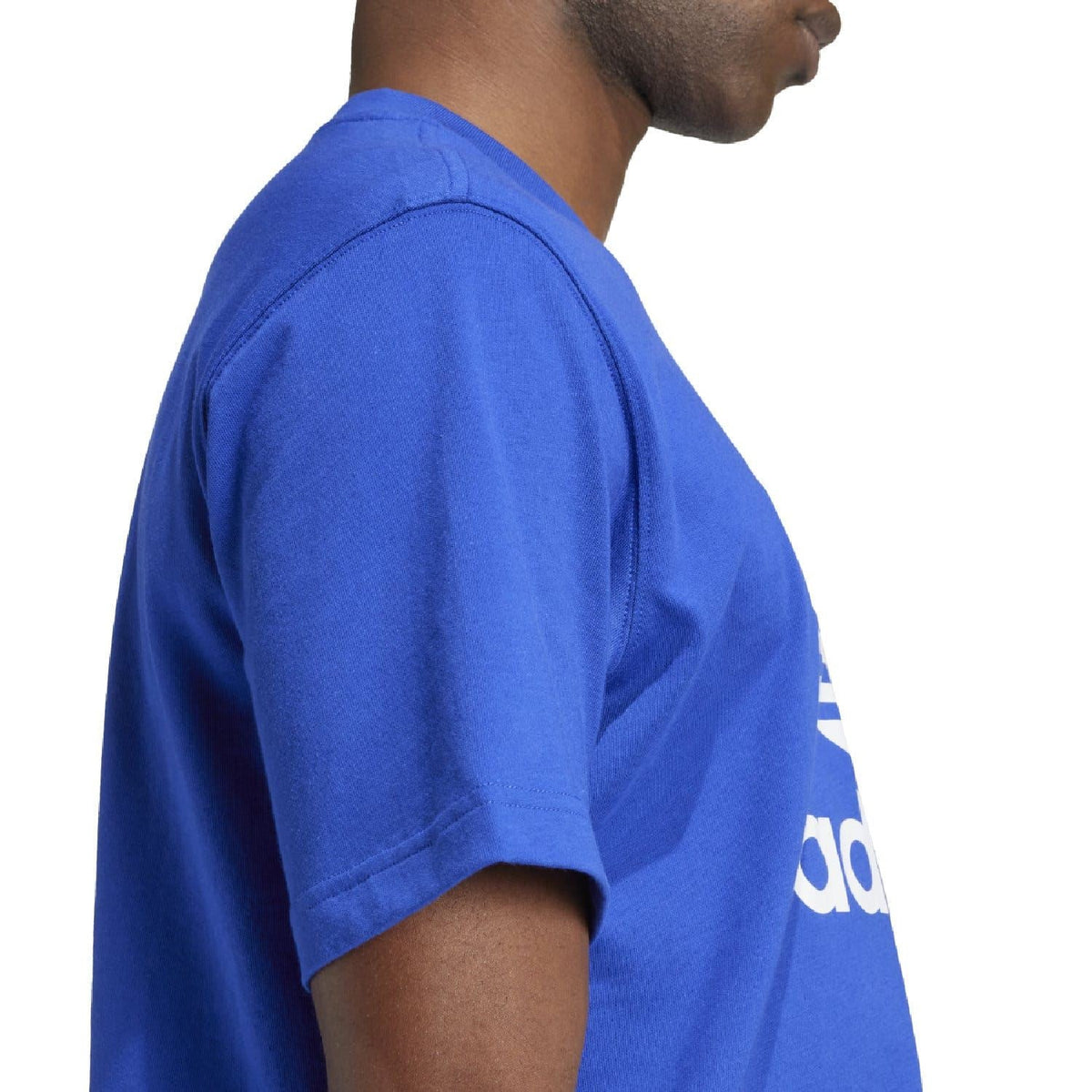 Blue t-shirt side view with white adidas trefoil logo print