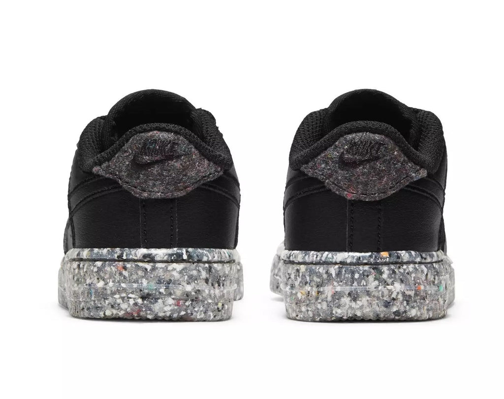 Toddler black sneakers with padded heel collar and speckled rubber platform sole