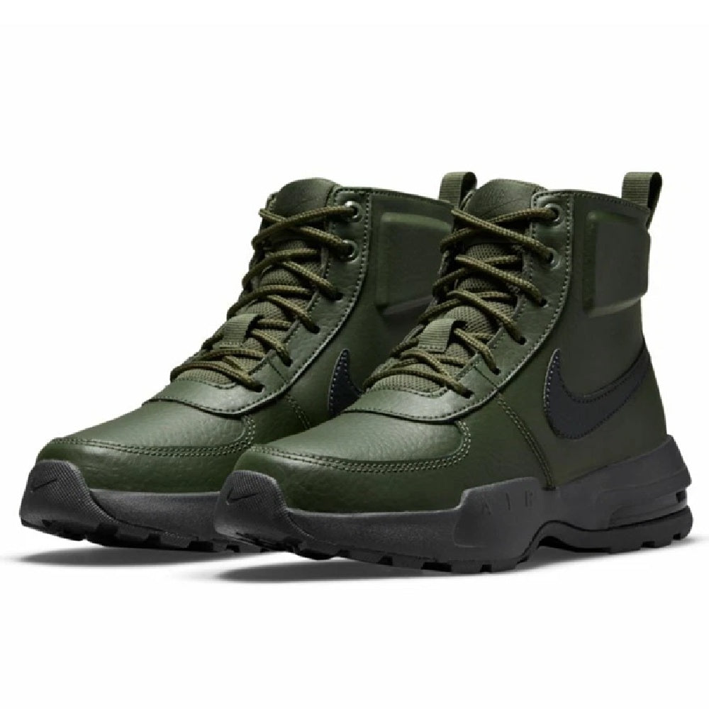 Pair of olive green lace-up mid-top boots with dark Nike swoosh and rugged soles