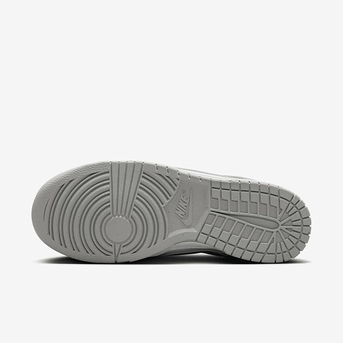 Gray Nike Dunk Low rubber outsole with traction tread, sneaker bottom view.