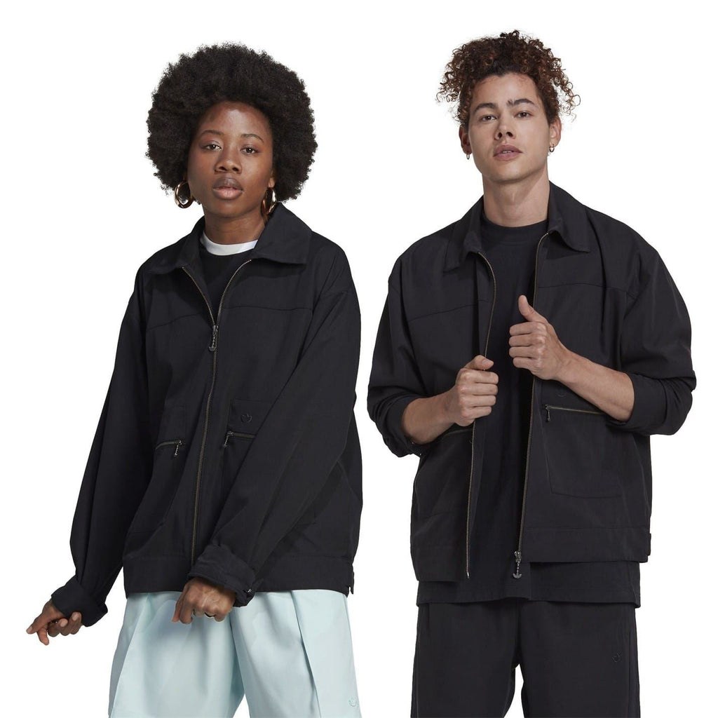 Black zip-up jacket on models, with stand collar and two chest pockets