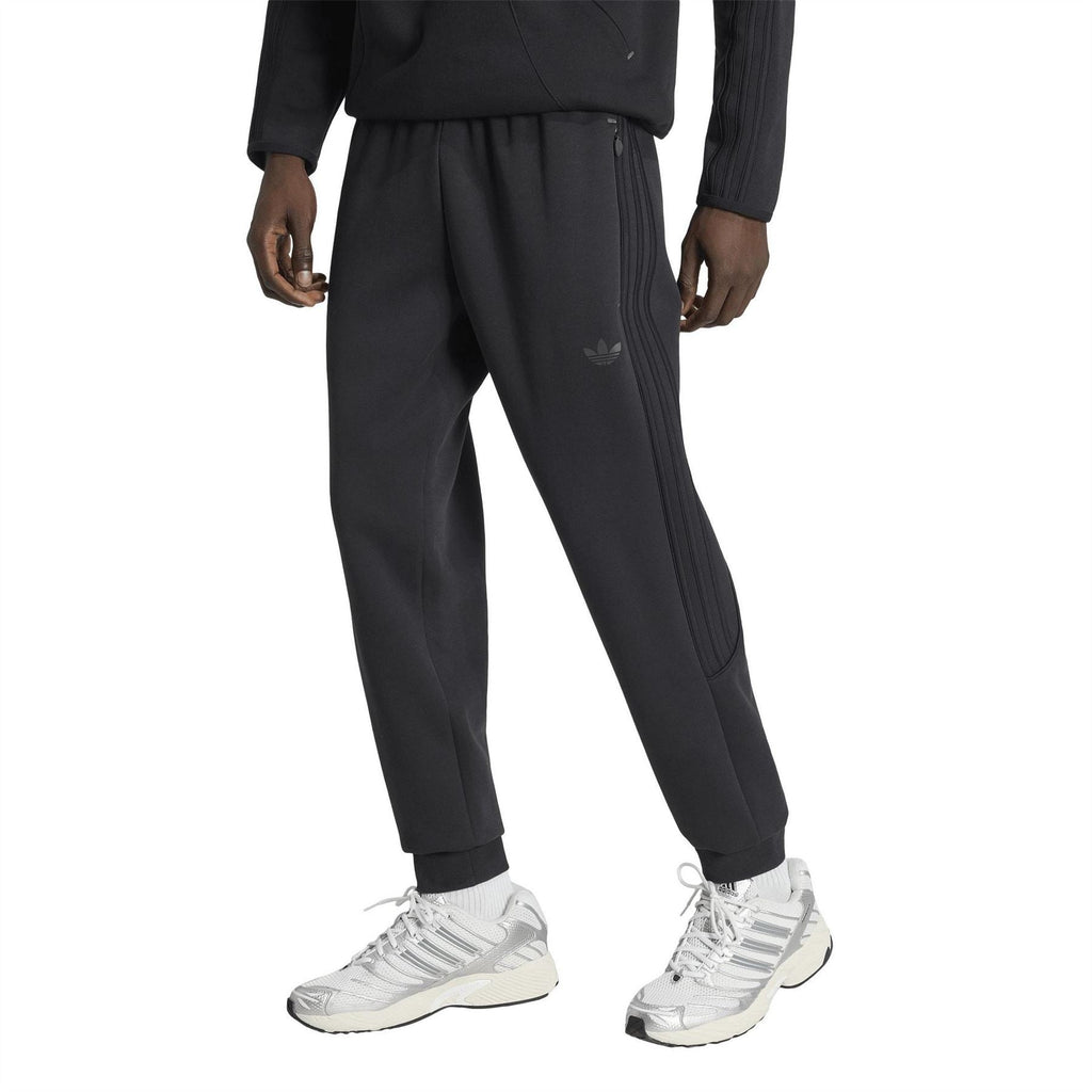 Black track pants with tapered leg, pleated front, side stripe details and trefoil logo