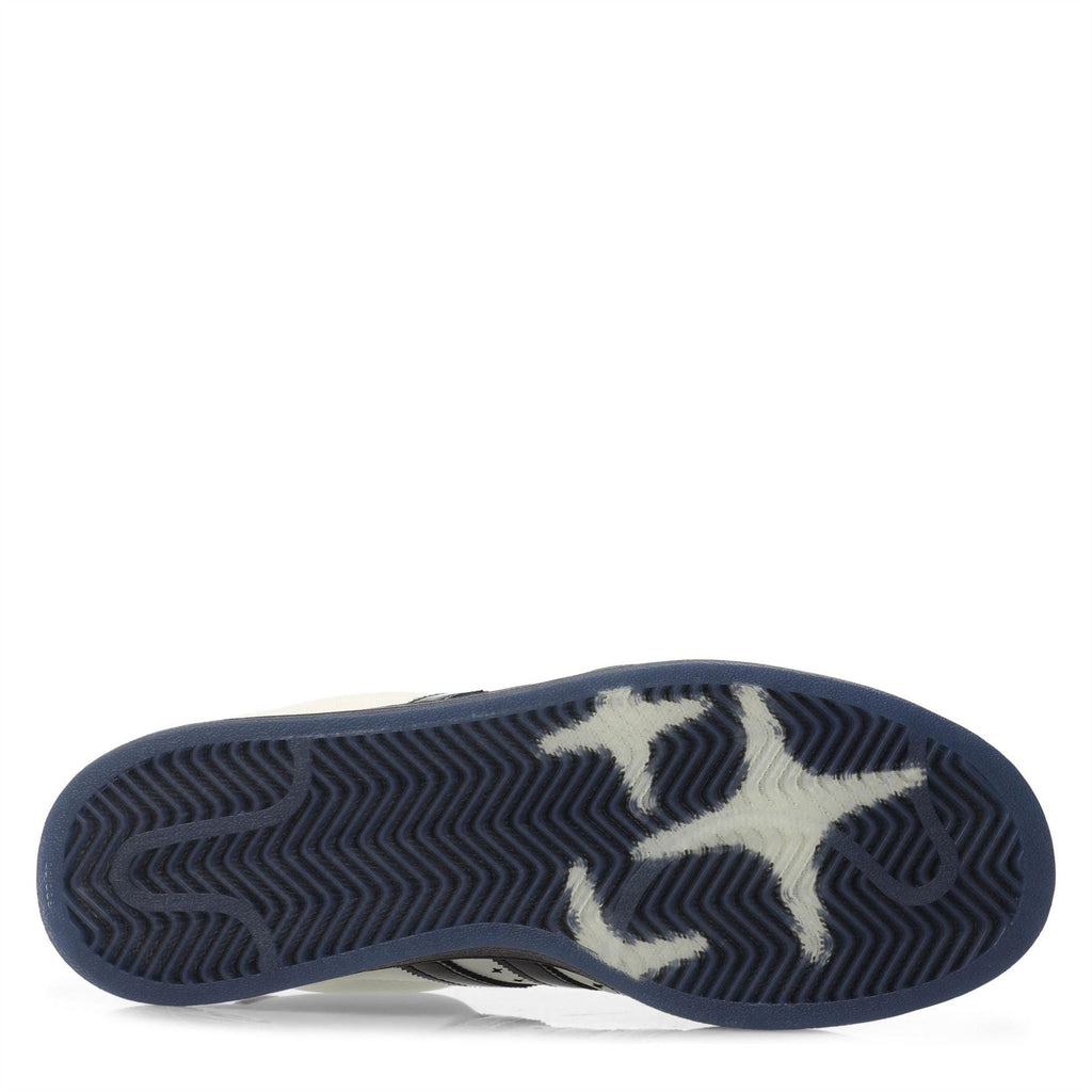 Rubber outsole of adidas low-top sneakers with textured zigzag traction