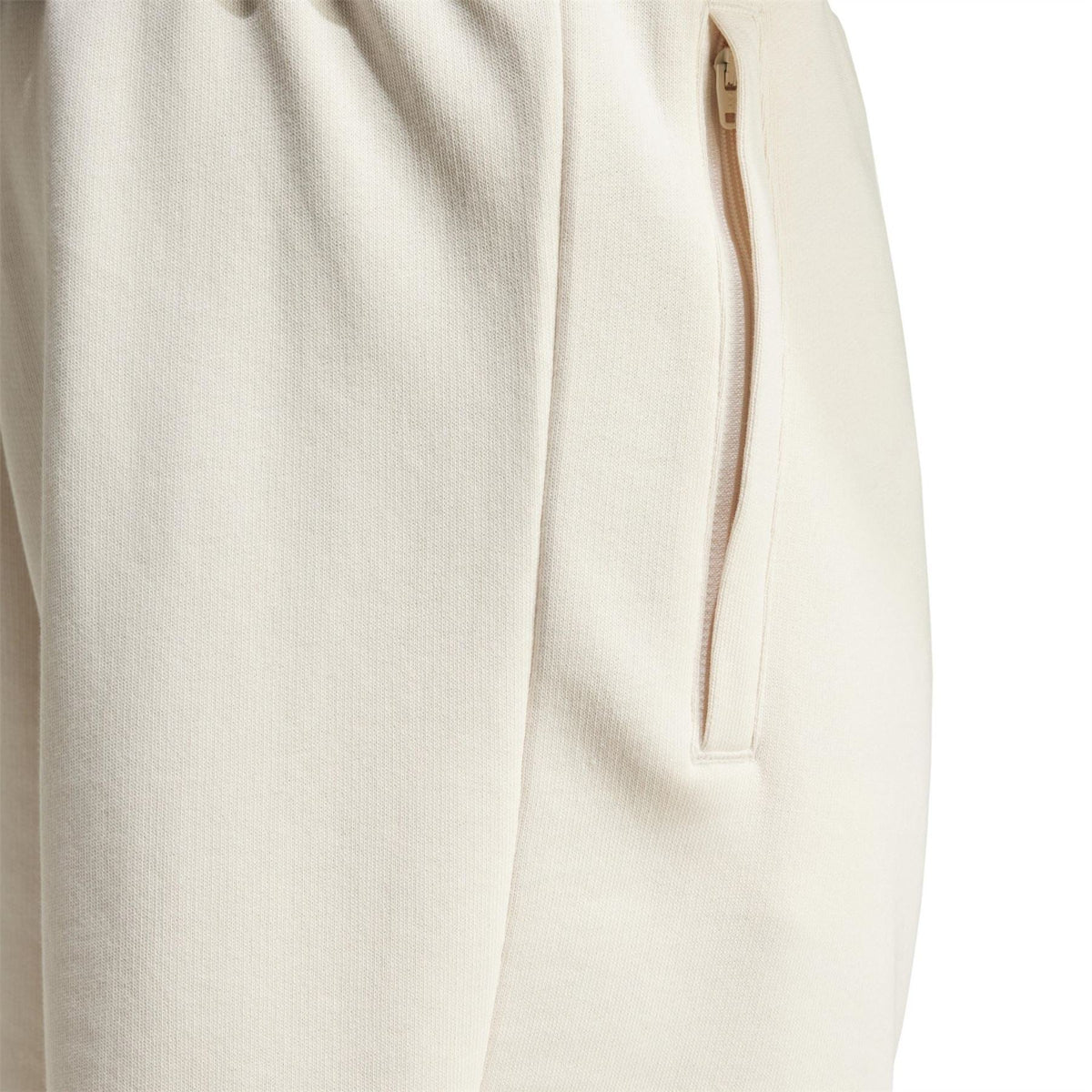 Wonder White Essentials shorts close-up of knit fabric and quarter-zip pocket opening