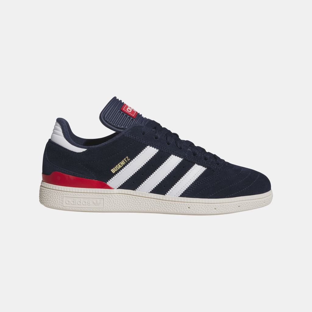 Navy suede Busenitz sneakers with white adidas stripes and red side stripe