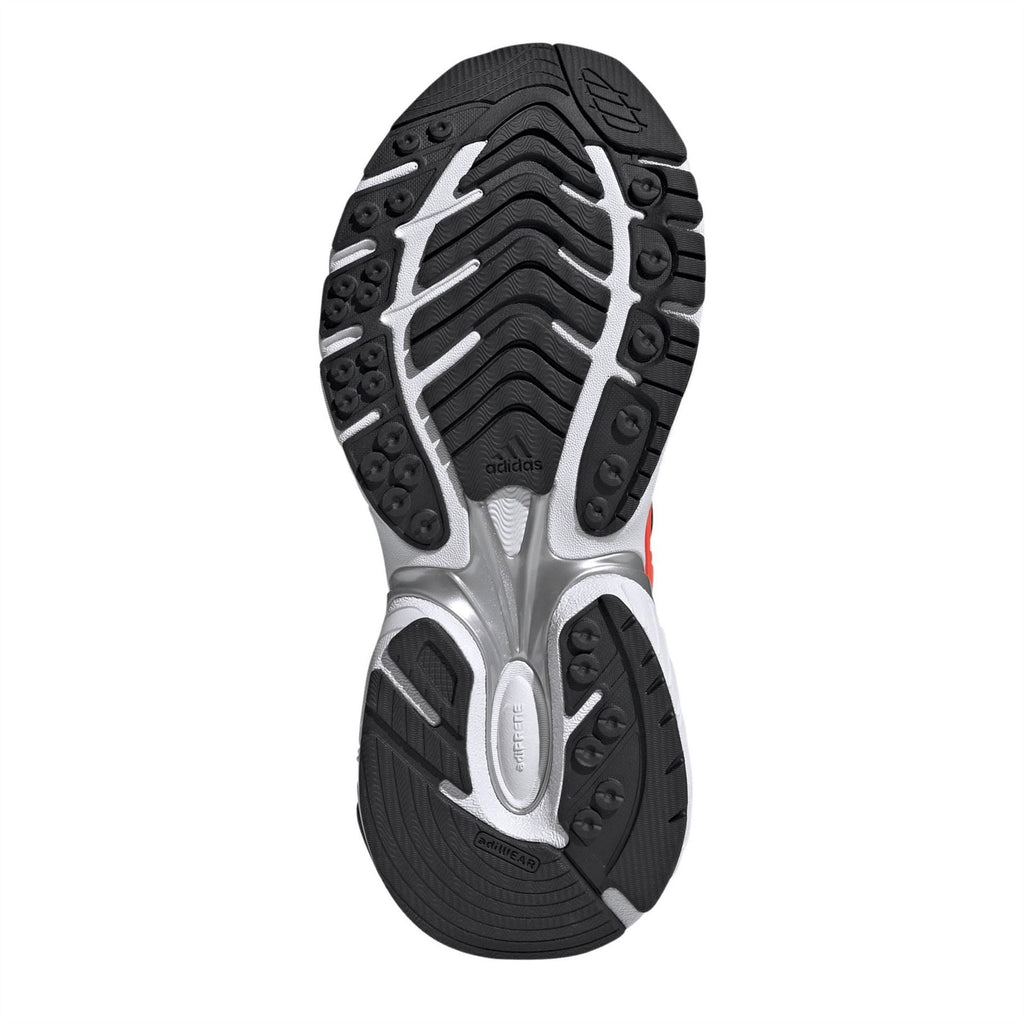Rubber outsole of white lace-up sneakers with traction lugs and Adidas logo
