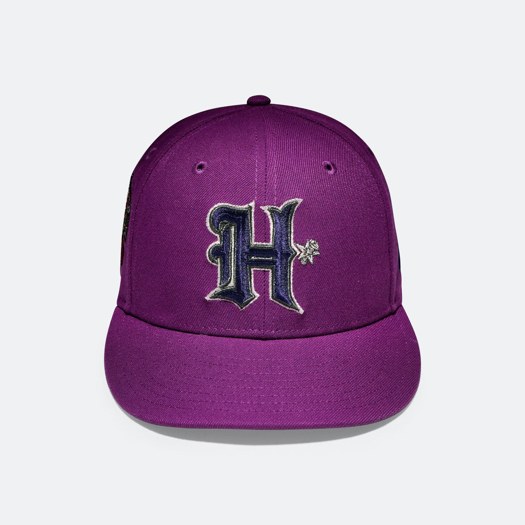 Purple baseball cap with embroidered H logo on the front panel