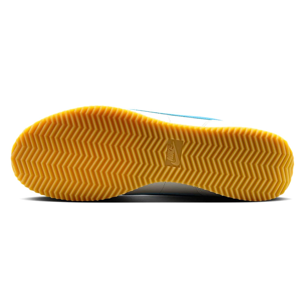 Nike outsole, gum yellow tread with zigzag pattern and Nike logo