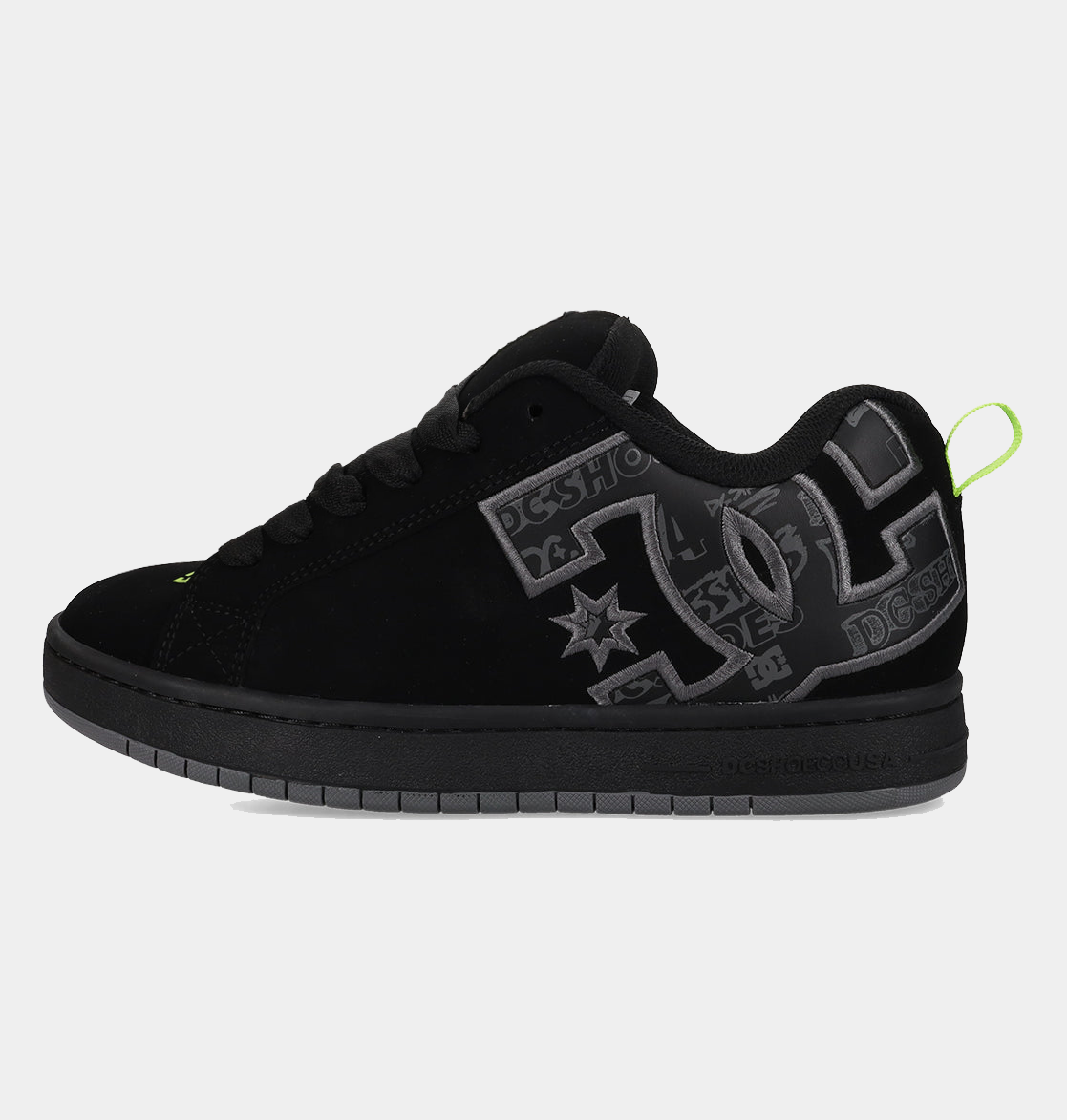 Black low-top sneakers with gray DC-style graphics and neon green heel detail
