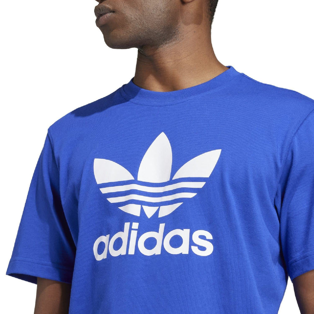Blue crew-neck t-shirt with large white adidas trefoil logo and wordmark