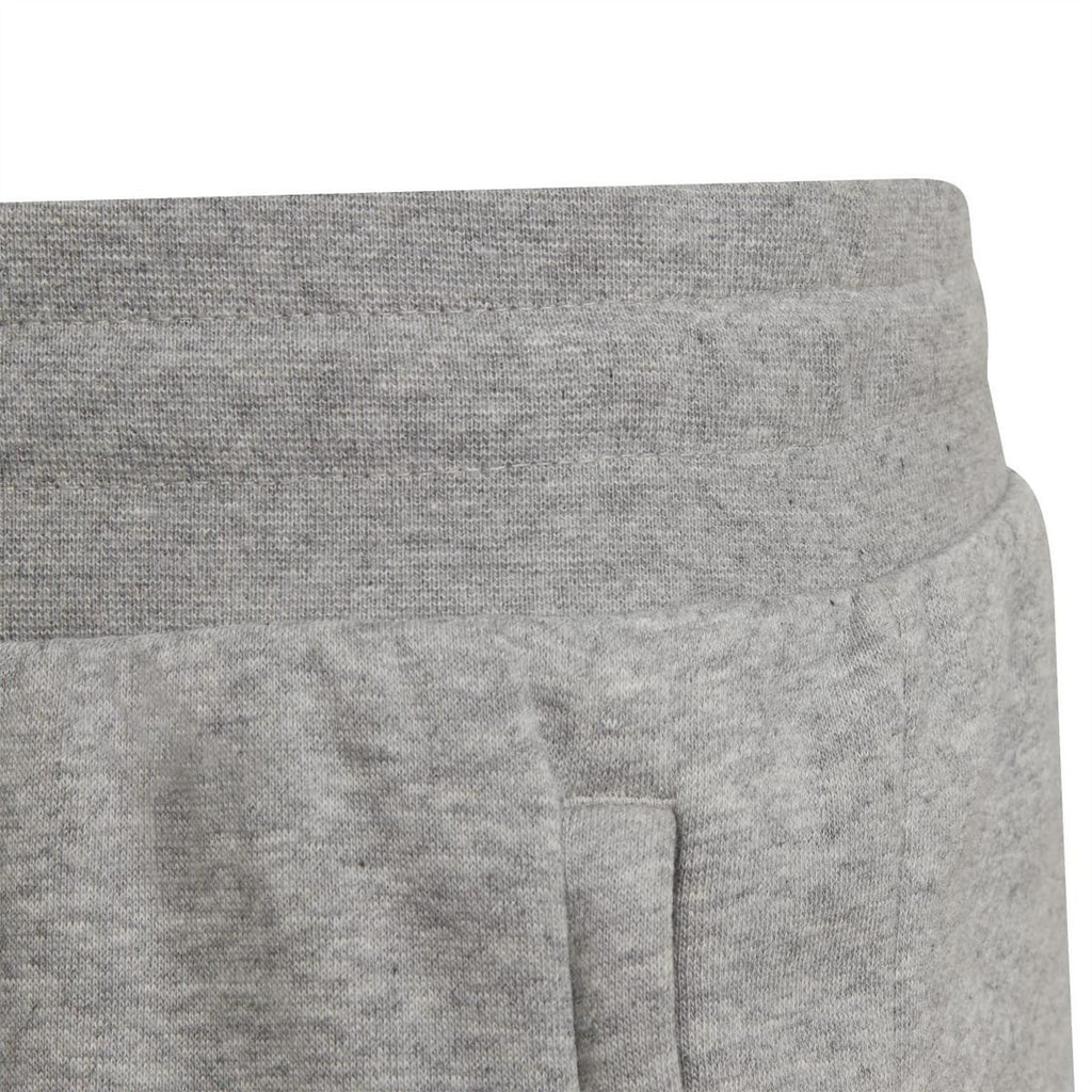 Grey shorts with small side seam panel detail near the hem