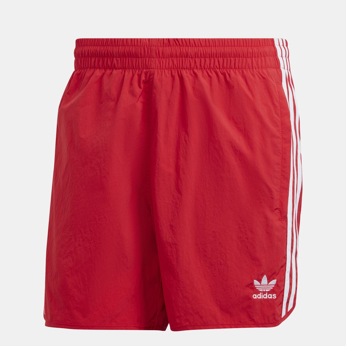 Red sprinter shorts with elastic waist, white side stripes, and adidas logo