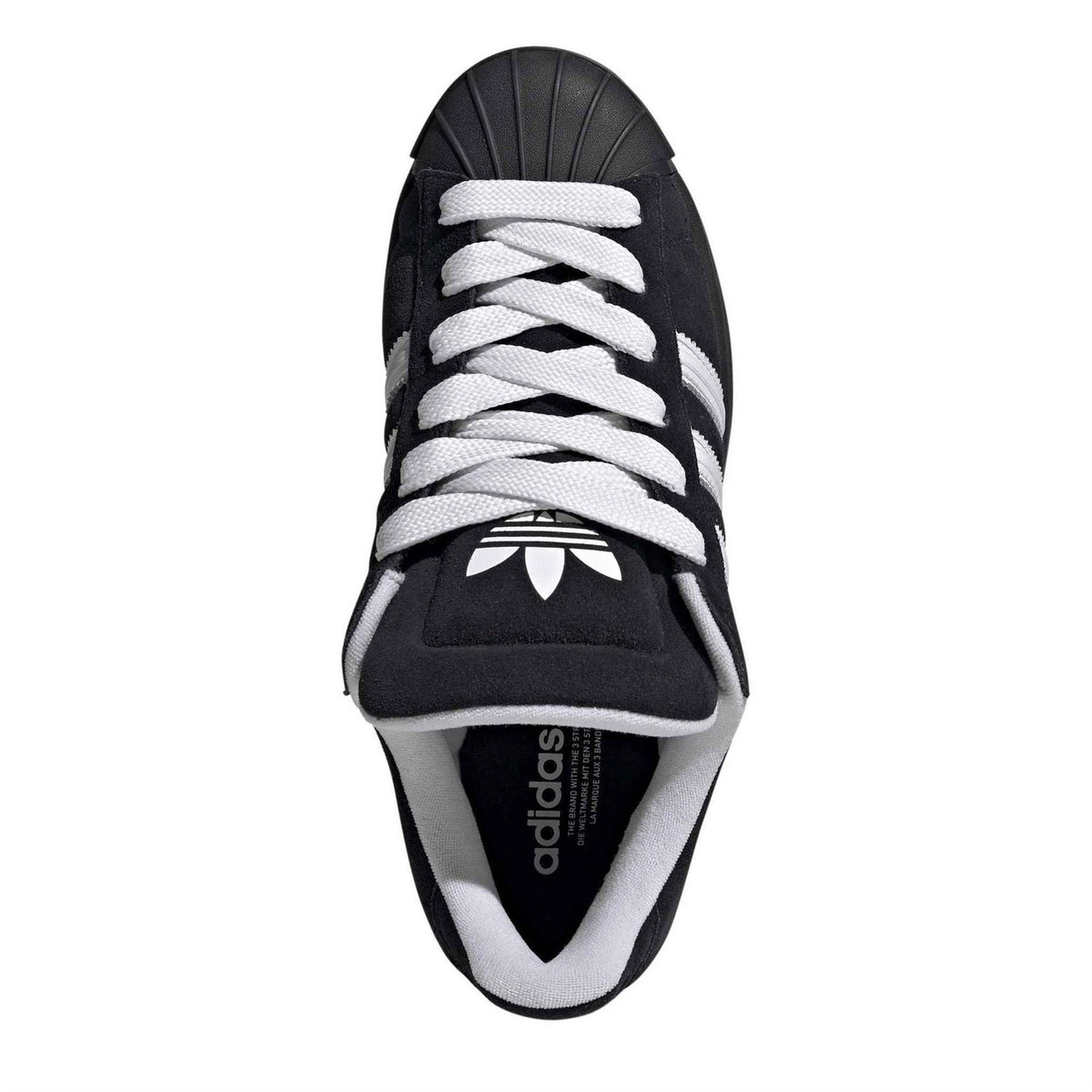 Black adidas low-top sneaker, white laces, adidas logo on tongue and lining