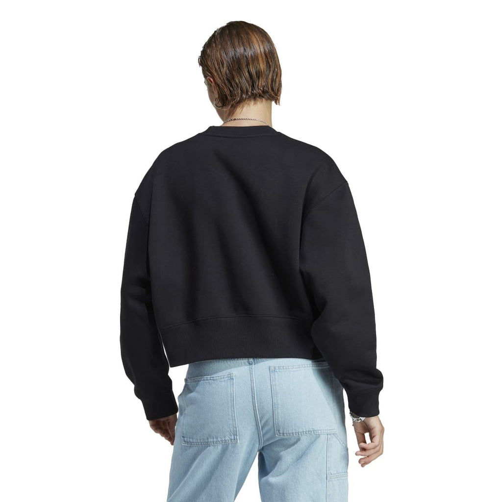 Black crewneck sweatshirt back view with ribbed hem and sleeves