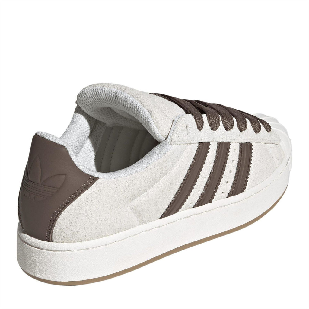 Off-white sneakers with brown heel panel and cushioned collar, white rubber midsole.