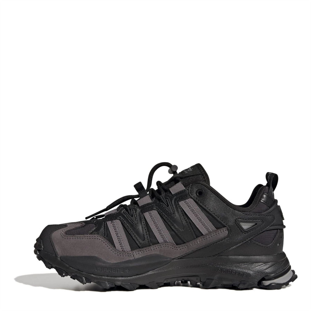 Black adidas lace-up sneaker with geometric strap overlays and cushioned sole.