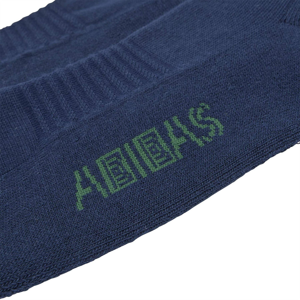 Navy crew sock close-up with green brain dead text and ribbed knit detail