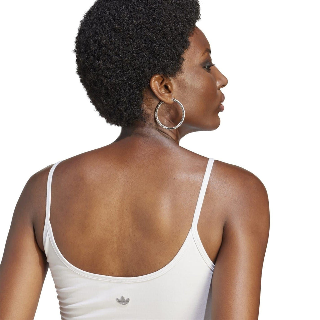 White cropped sports bra back view with thin straps and small logo