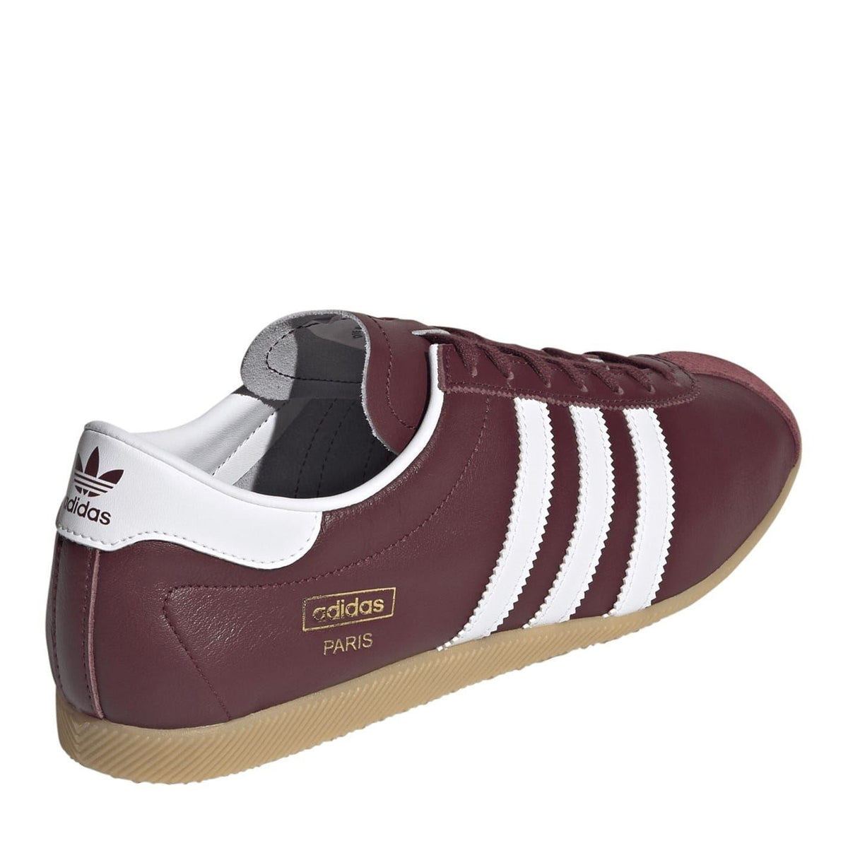 Burgundy low top sneakers with white stripes, heel pull tab, and gum sole