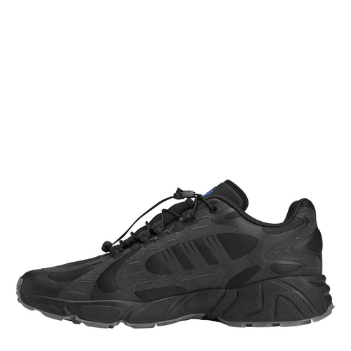 adidas Originals 100t Savage footwear showing black and white sneakers with sporty design and brand logo on the side