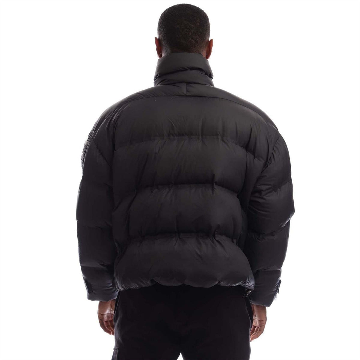 Black adidas Originals puffer jacket back view with quilted insulation panels