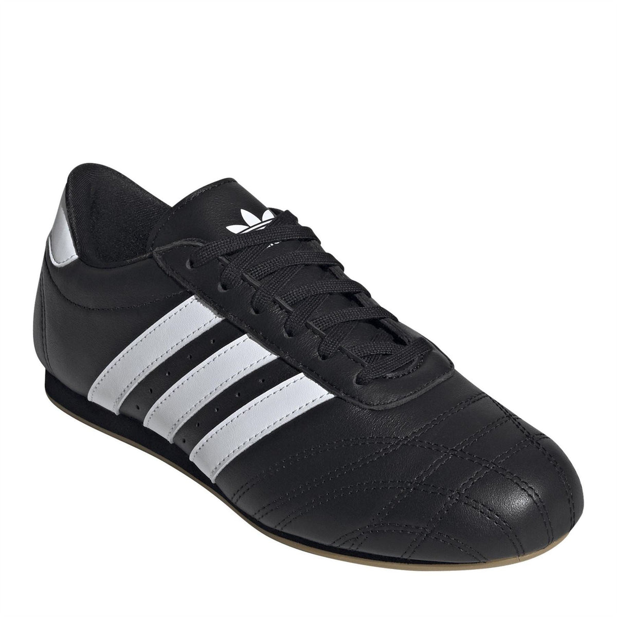 adidas Originals Taekwo low top sneakers in white with black accents, featuring a sleek design and classic athletic style.