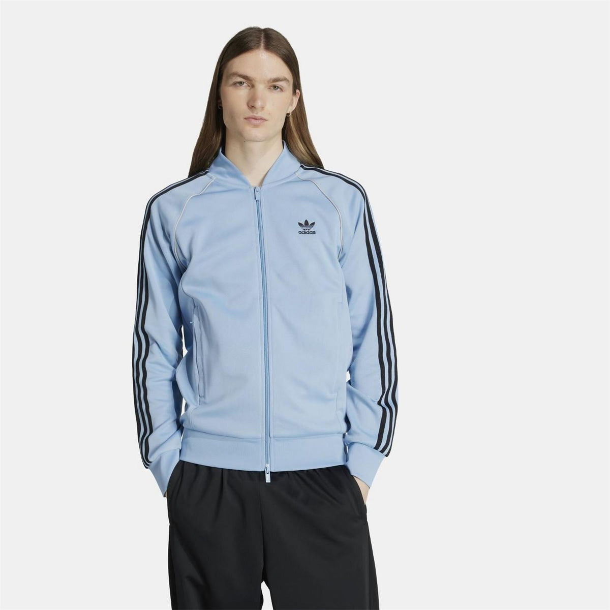Black adidas Originals Classic SST track jacket with zip-up front and ribbed cuffs, part of the adidas Originals tracksuit collection.