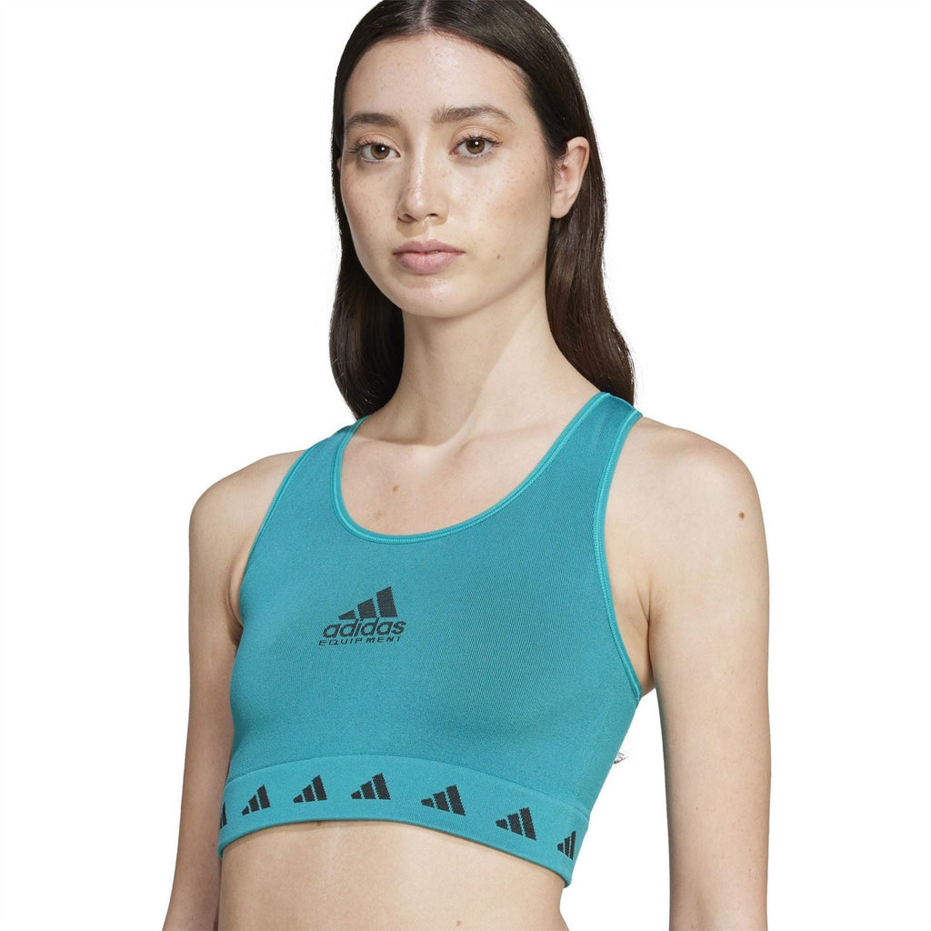 Teal adidas Originals cropped tank with center chest logo and patterned hem band; front view