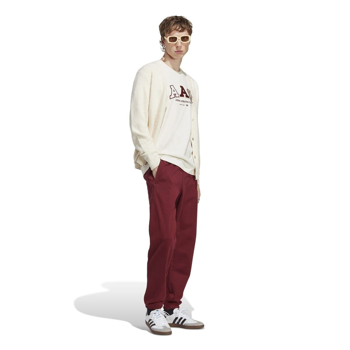 Burgundy jogger-style track pants with A logo on the thigh