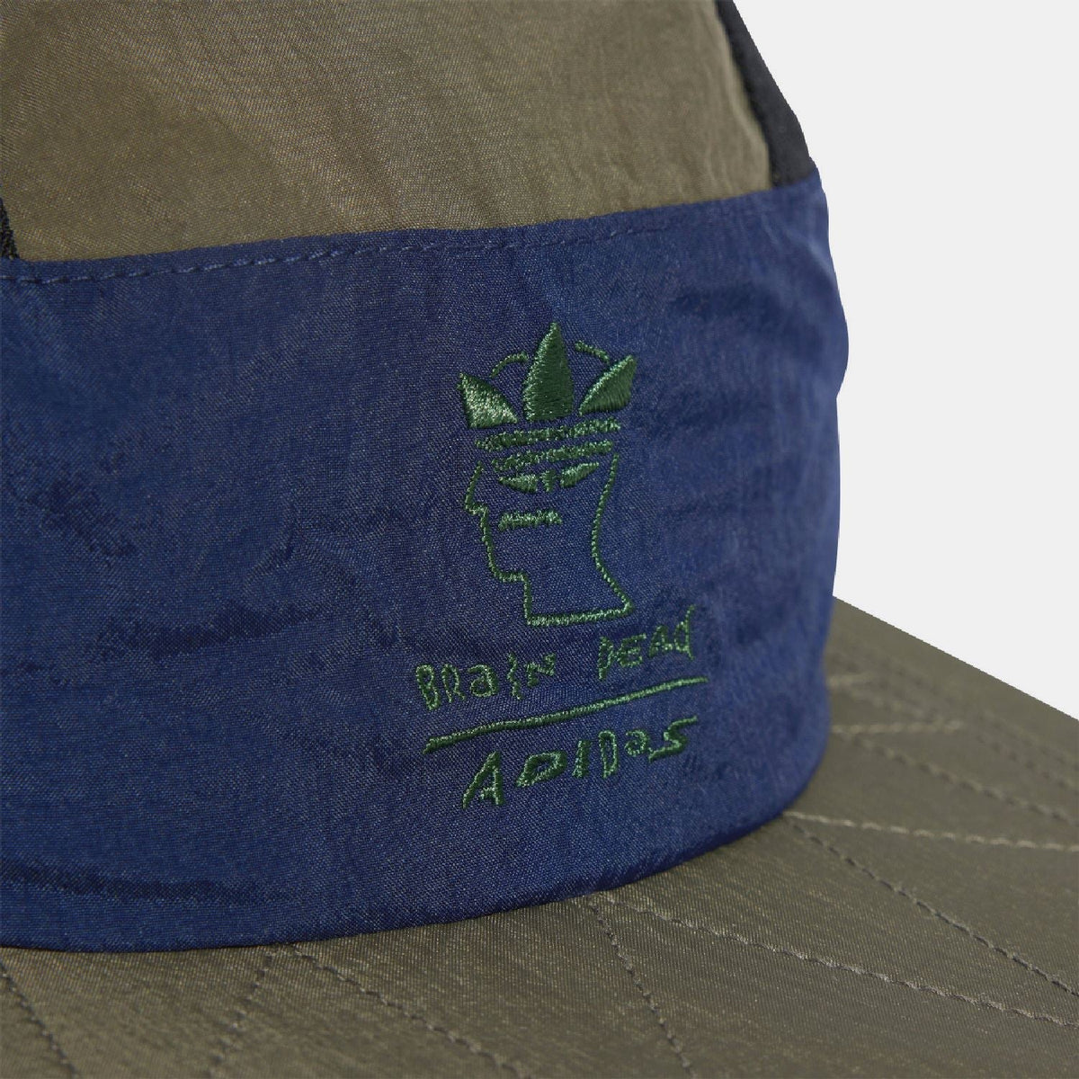 Embroidered front logo patch on blue band of two-tone cap