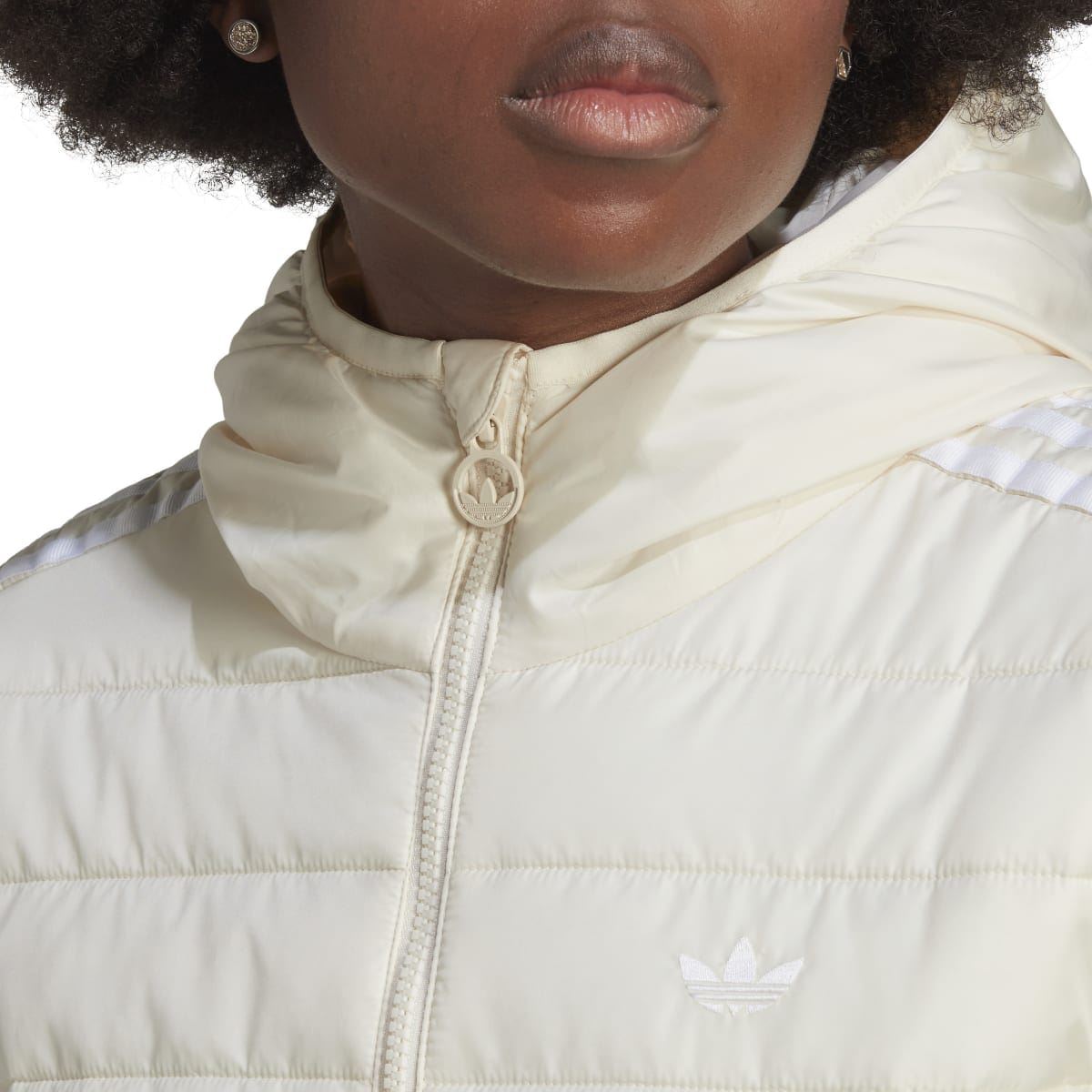 Off-white hooded puffer jacket with stand collar, front zipper, and adidas logo
