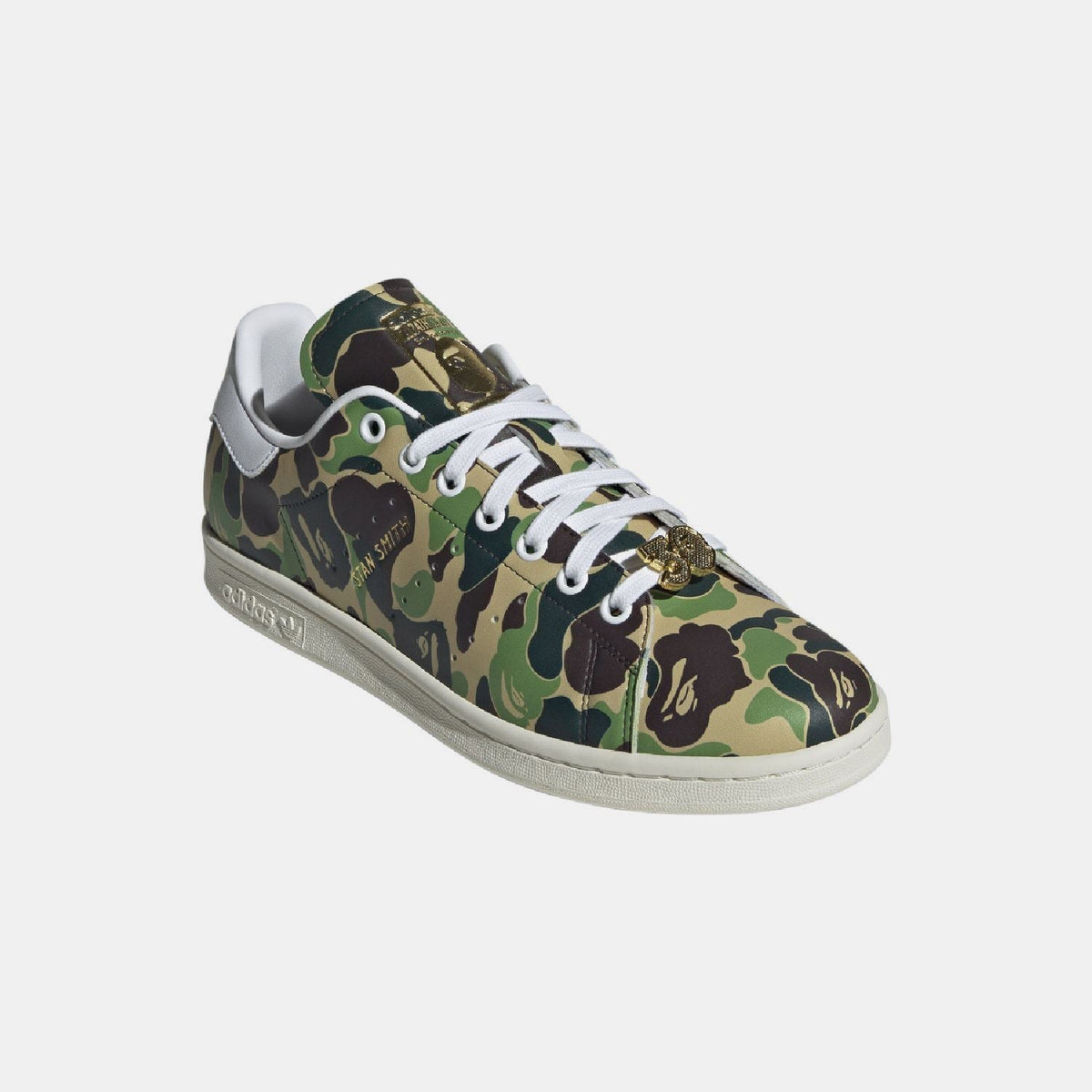 adidas Originals Bape Stan Smith shoes, white sneakers with green accents, classic footwear style with brand details visible.