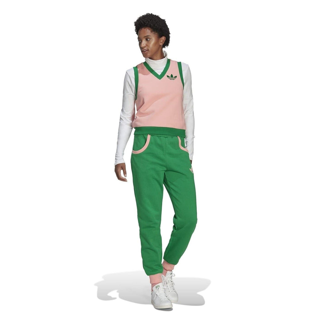 adidas Originals Adicolour 70s sweater vest featuring colorful striped design and classic fit, worn as a stylish tops option