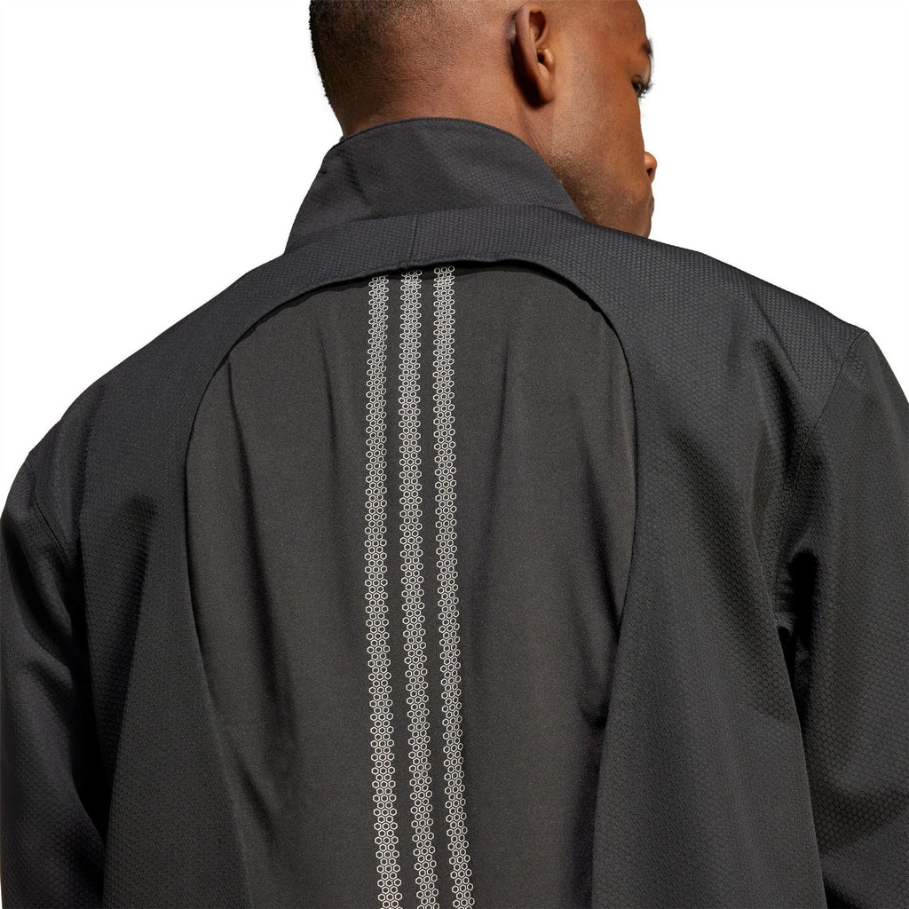 Back of black hooded windbreaker with vertical ventilation stripe
