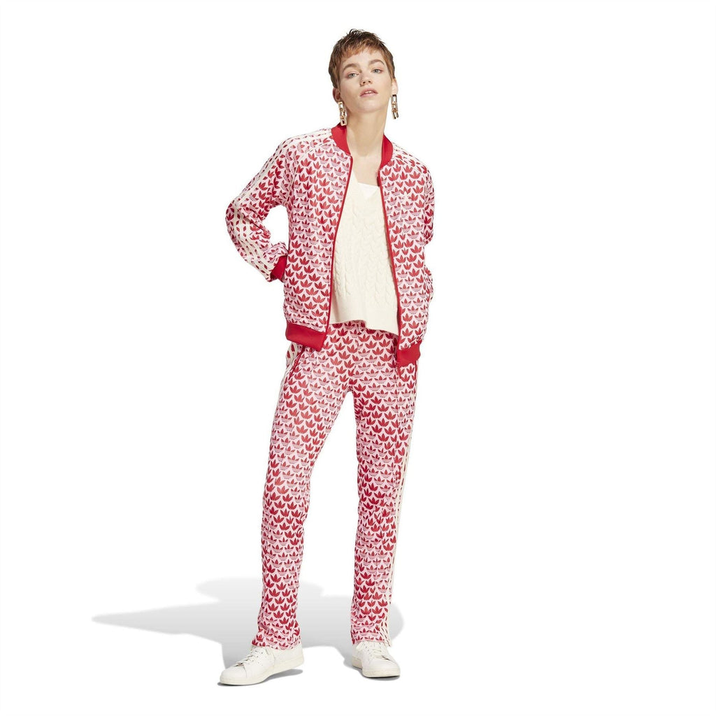 Red-and-white all-over logo print track pants, ankle length with elastic waist
