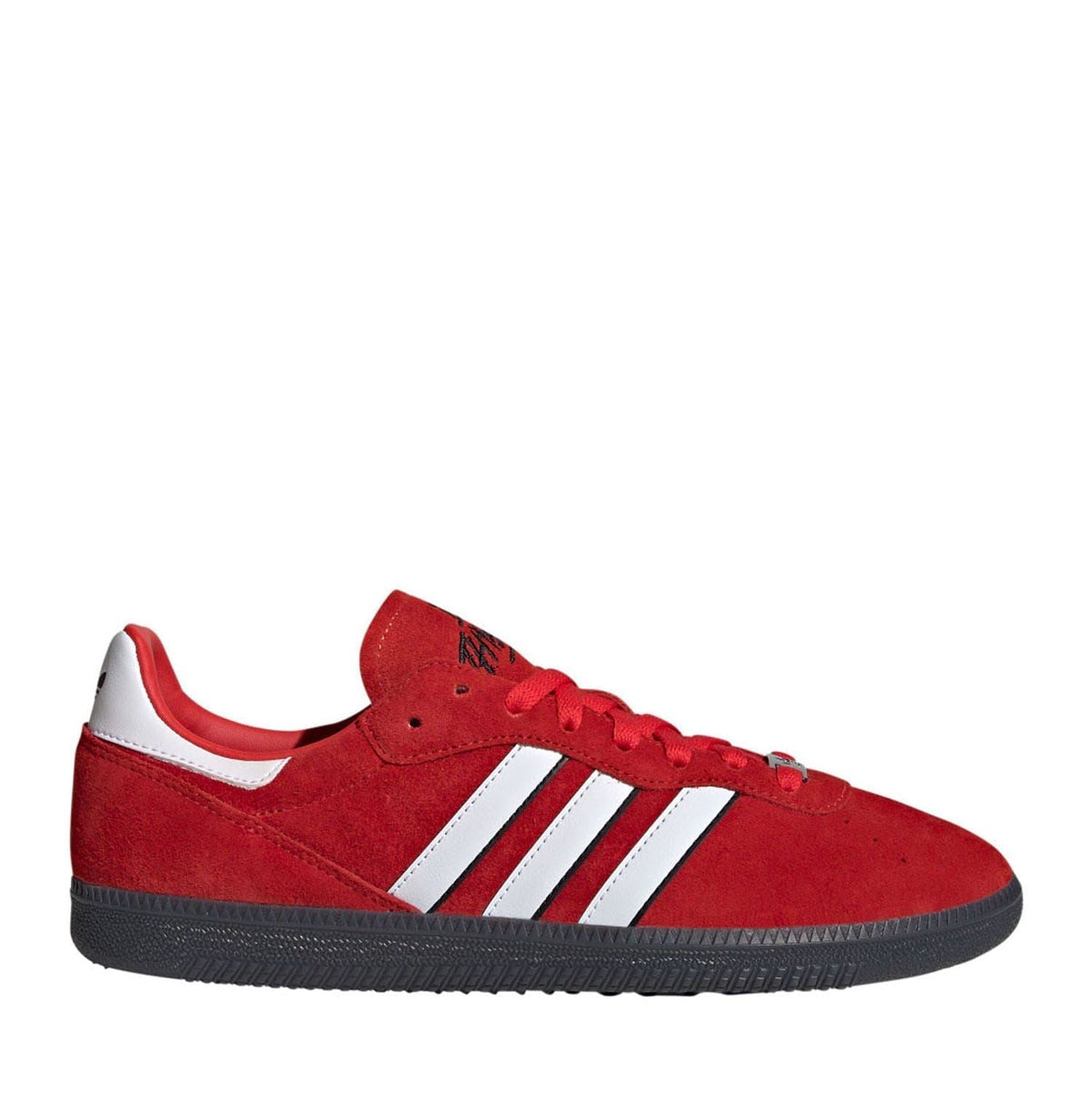 Red suede low-top trainers with white adidas stripes and lace-up front