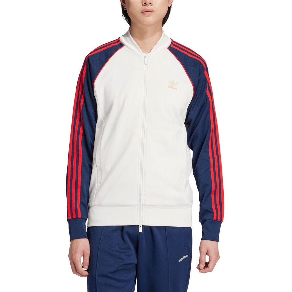 White zip-up track jacket with navy sleeves and red shoulder stripes, Adidas logo on chest
