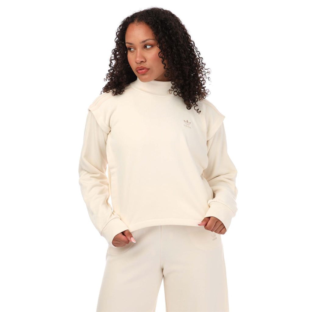Cream crewneck sweatshirt with long sleeves and small adidas Trefoil logo