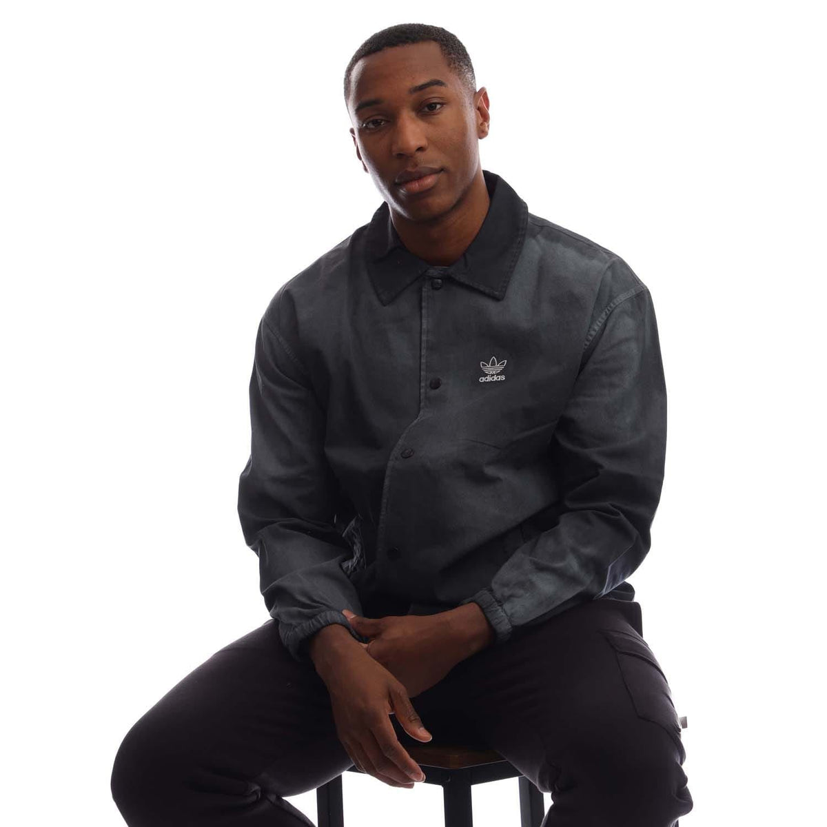 Black coach overshirt with button front, collar, and chest logo embroidery