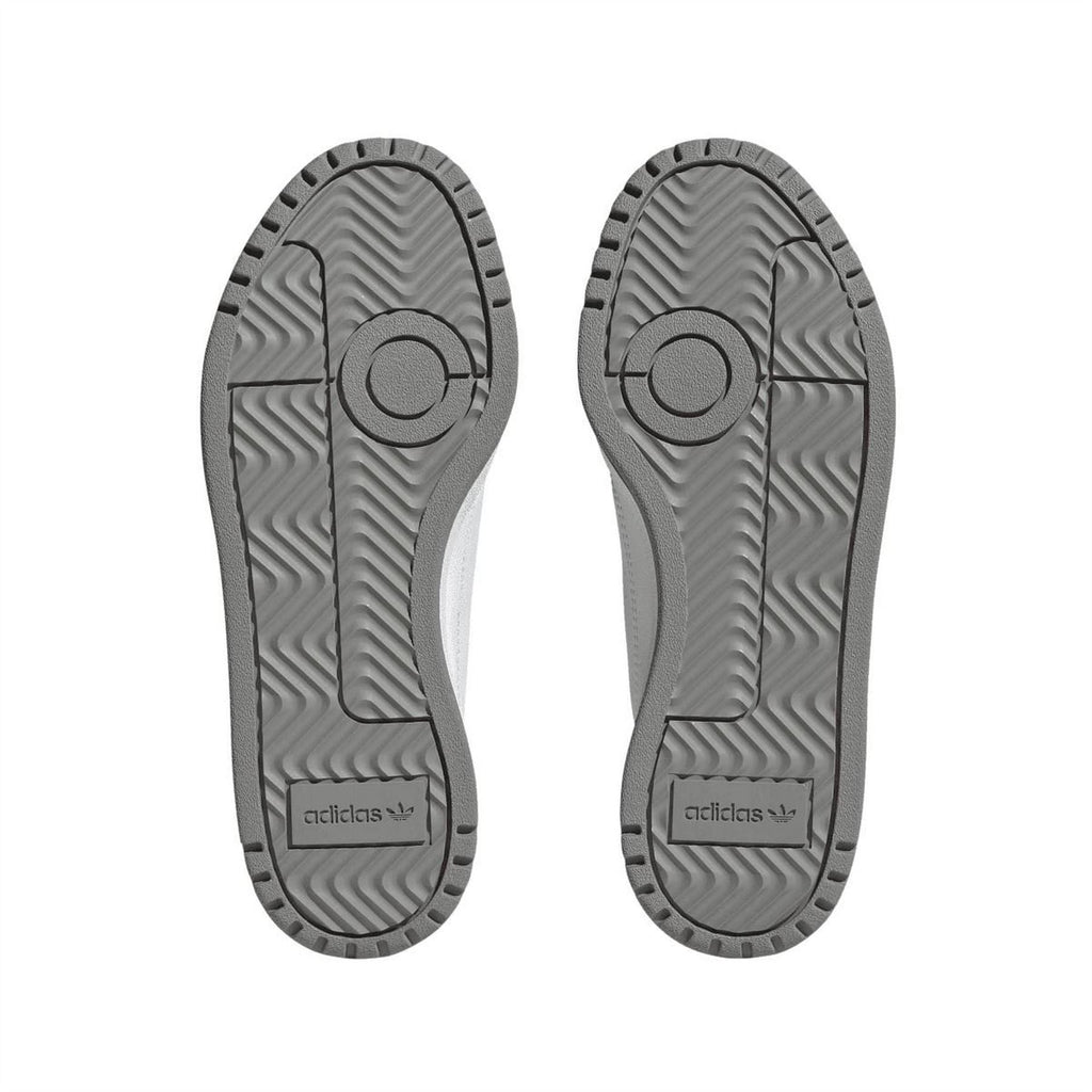 Pair of trainer outsoles with patterned tread and adidas logo on heel