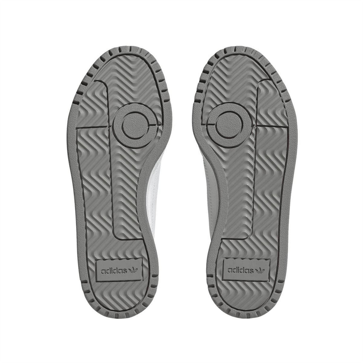 Pair of trainer outsoles with patterned tread and adidas logo on heel
