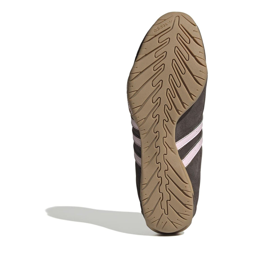 Gum rubber outsole for dark brown low-top sneakers with three light stripes