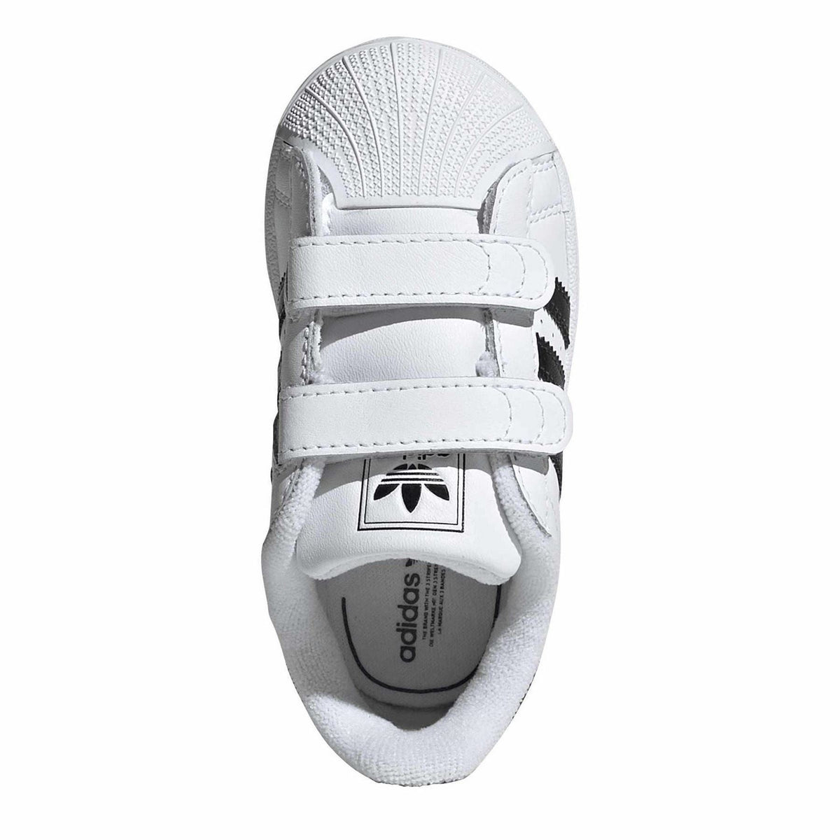 White sneaker tongue with adidas Trefoil logo and double hook-and-loop straps