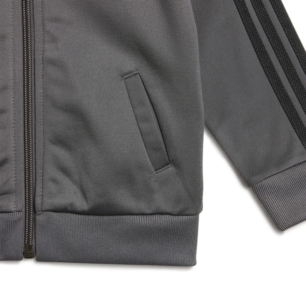 Grey adidas infants track jacket sleeve and side pocket detail with ribbed cuff
