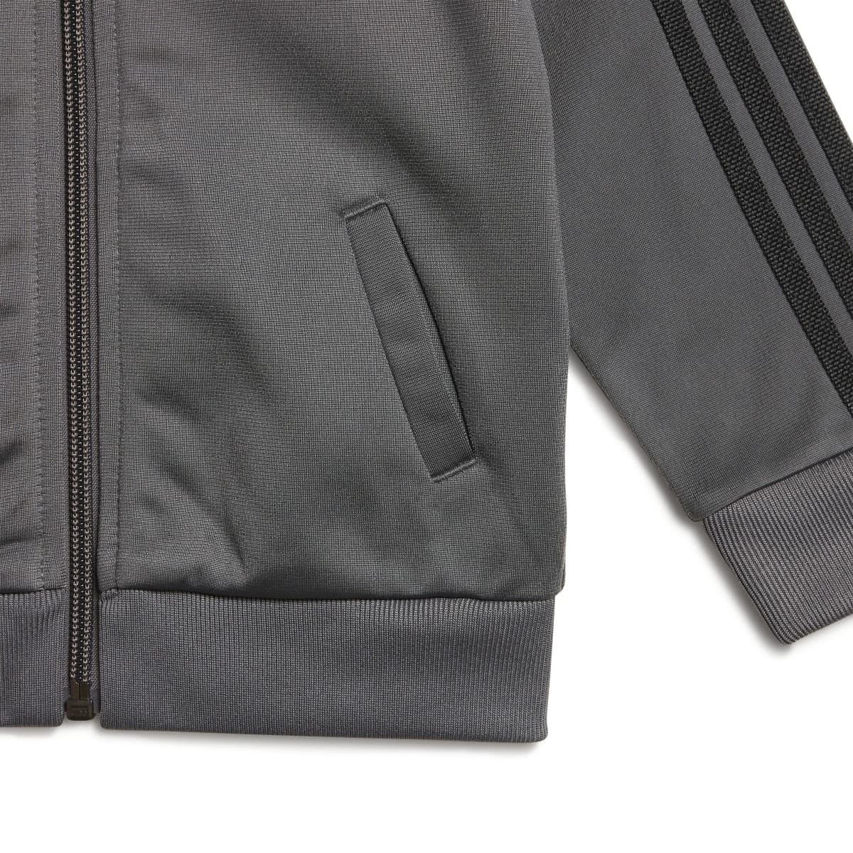 Grey adidas infants track jacket sleeve and side pocket detail with ribbed cuff