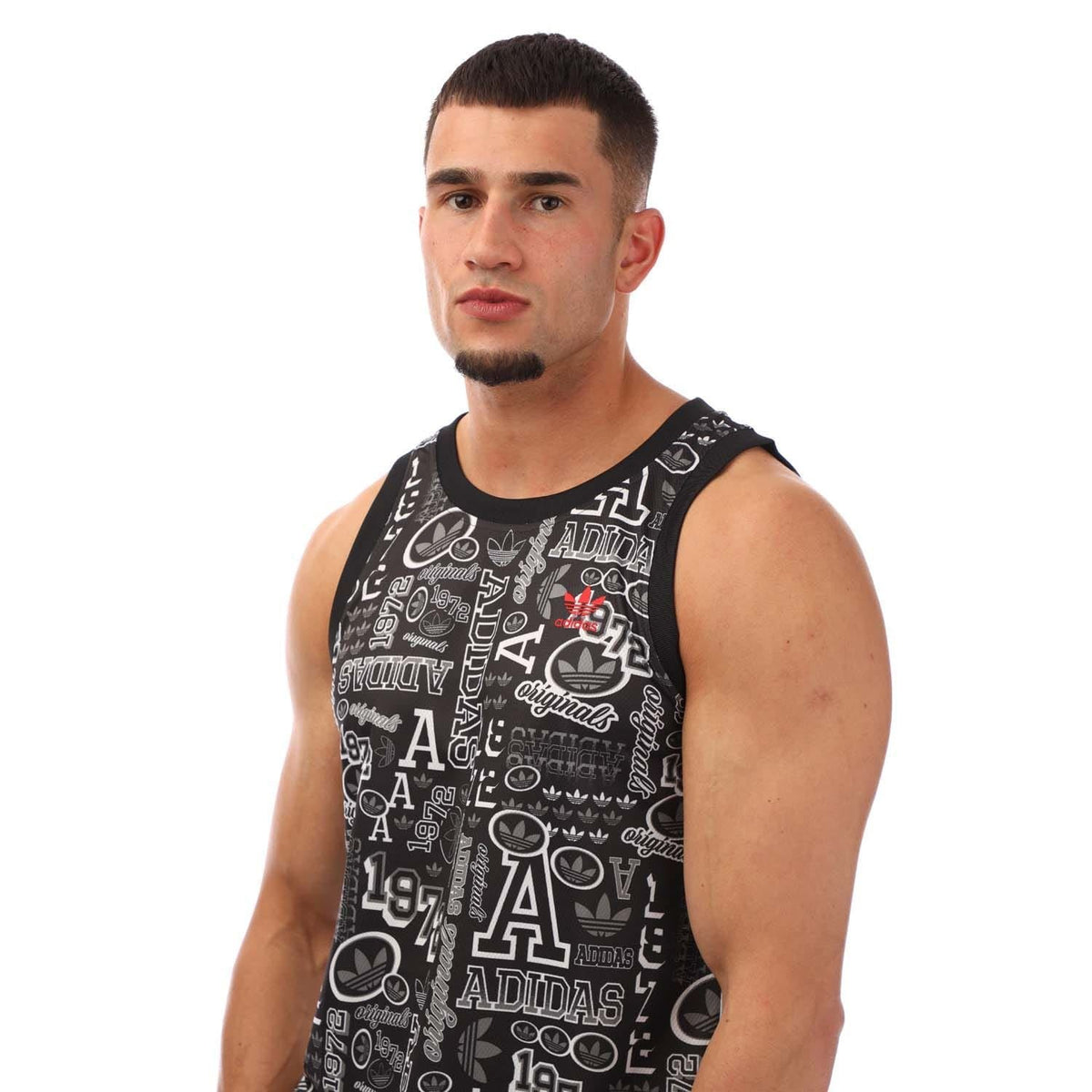 Black basketball tank top with white abstract logo print and sleeveless crew neck