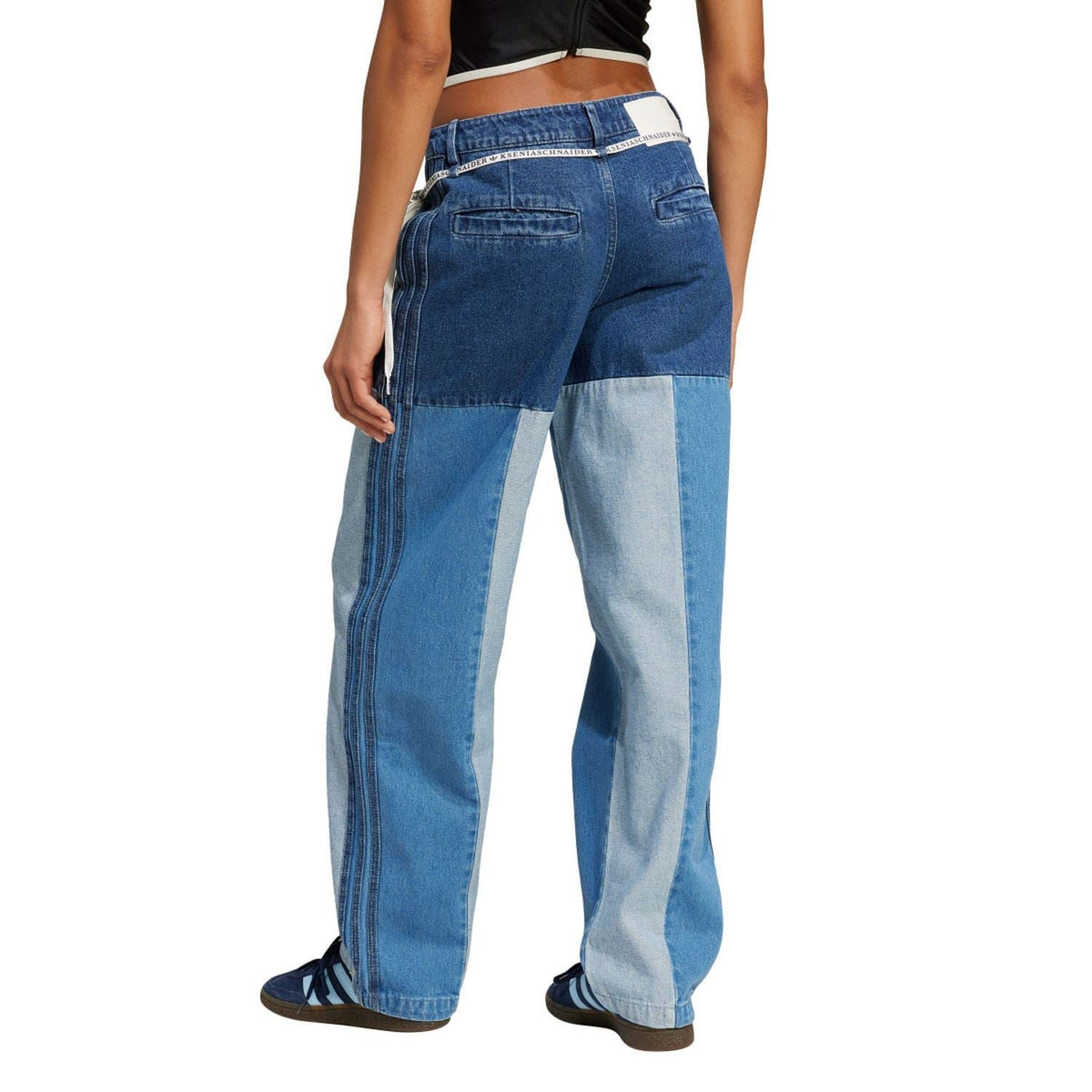 Back view patchwork straight-leg jeans with mixed blue panels and belt loops.