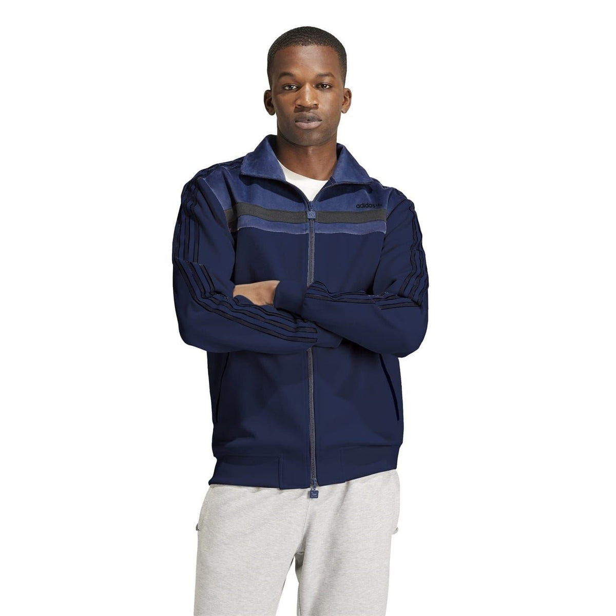 Navy athletic top with funnel neck, full-length zipper, and adidas logo on chest