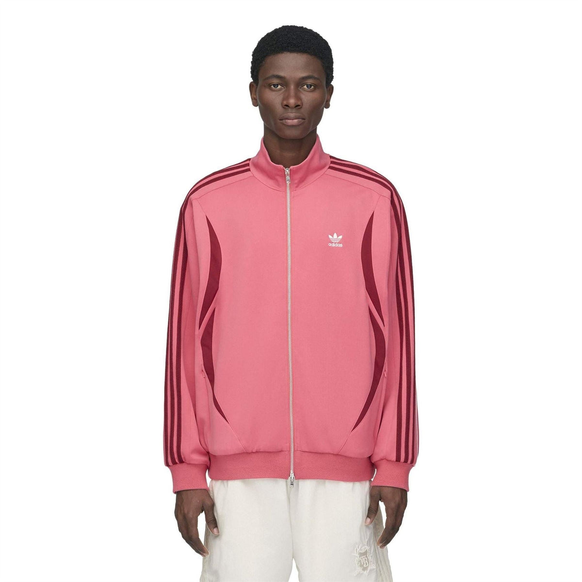 Pink track top with stand collar, full zipper, and small adidas logo on chest