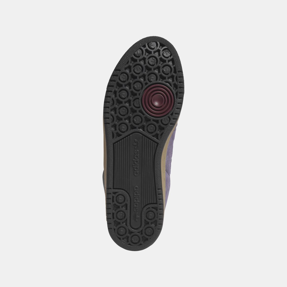 Black rubber outsole with circular tread pattern on adidas Originals low-top shoes